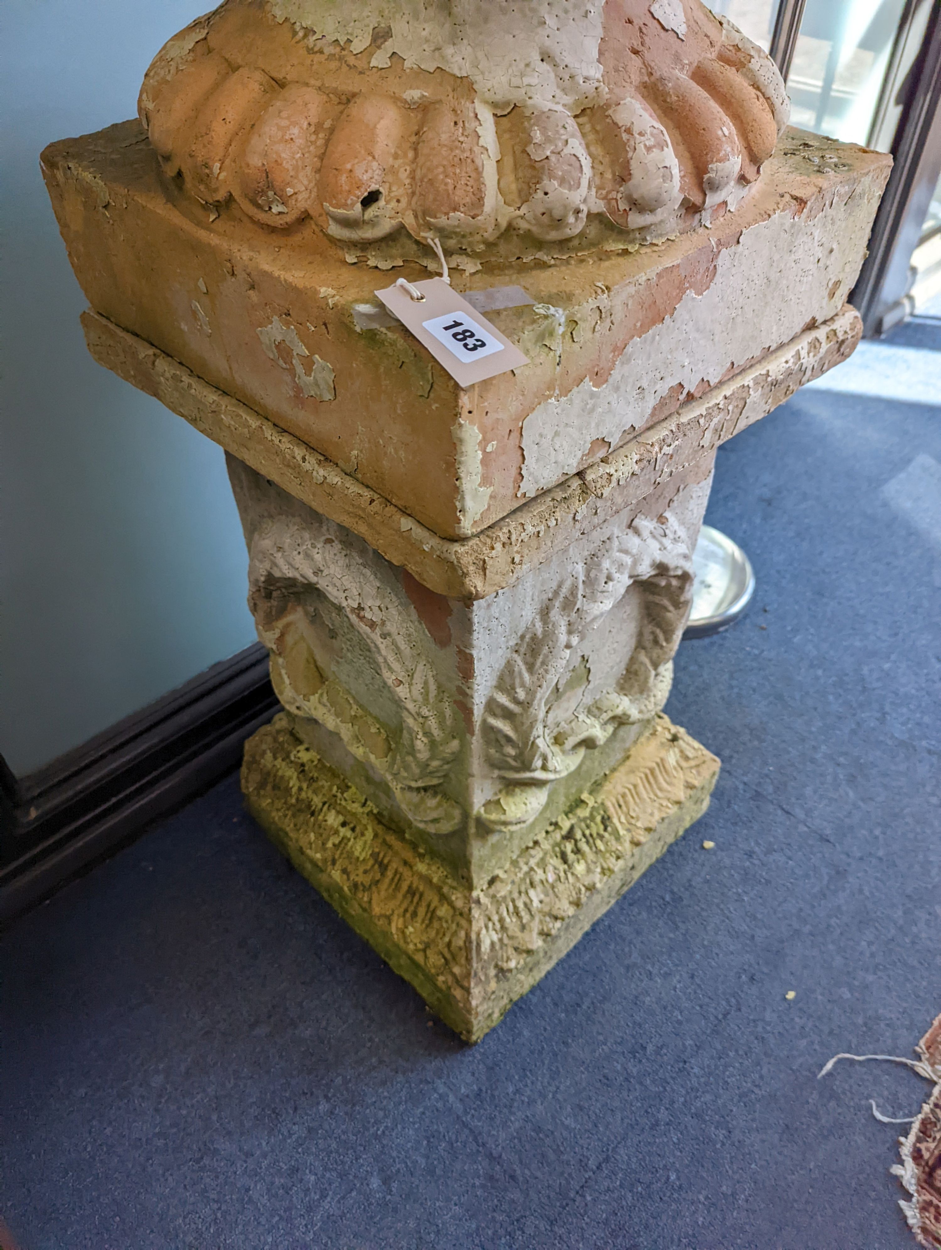 A large weathered Victorian painted terracotta lidded urn on plinth base, diameter 64cm, height 200cm